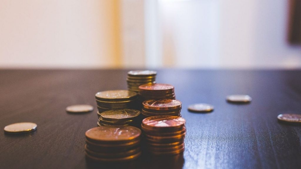 Coins on a wooden table
