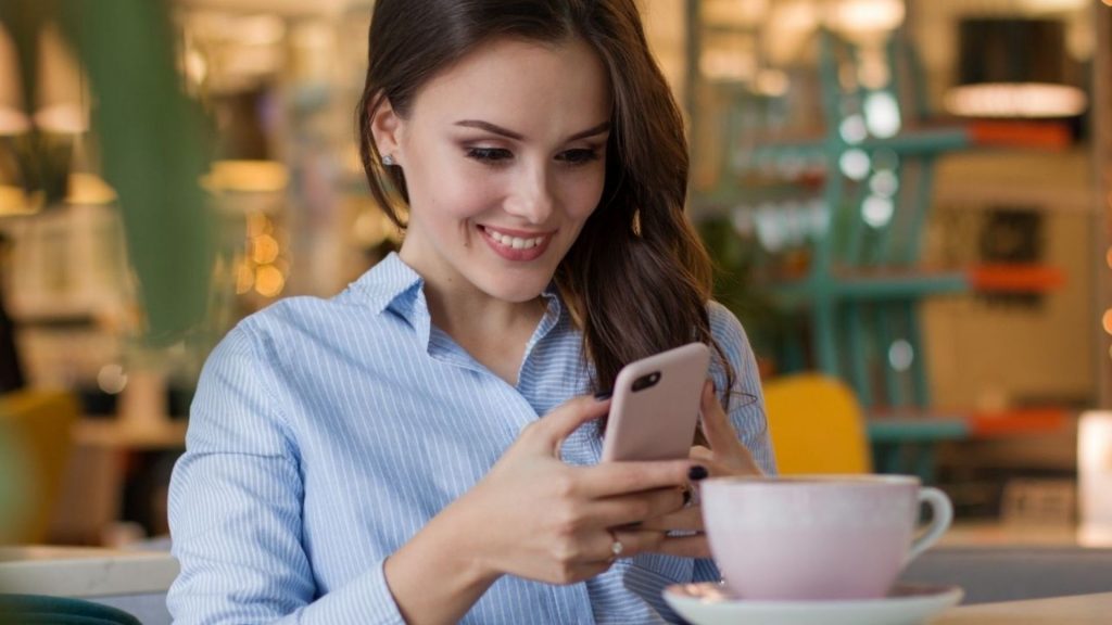 Woman smiling while on phone