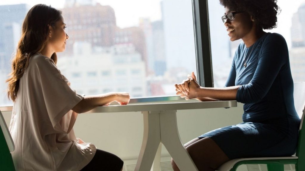 Women discussing at a table