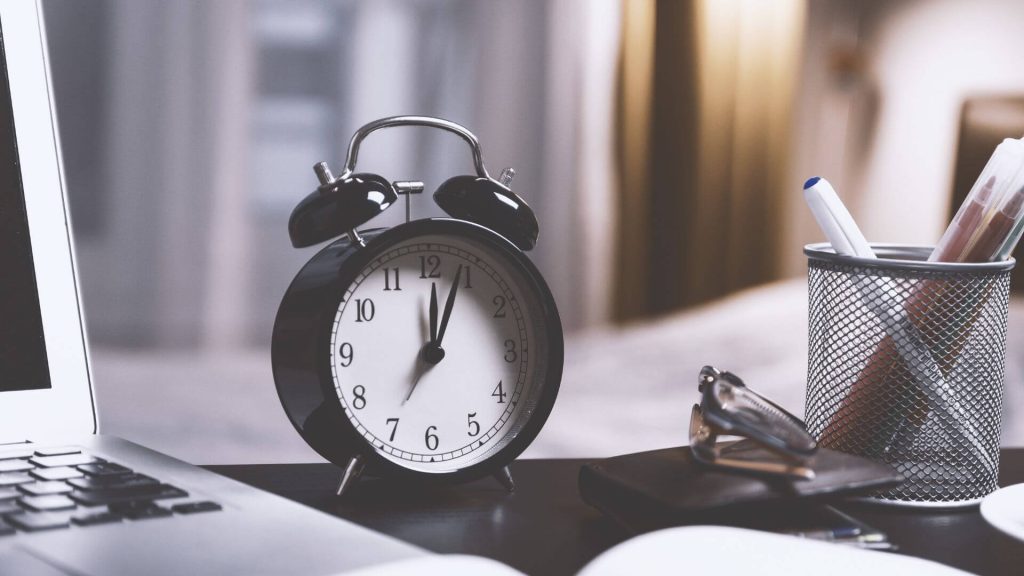 black clock on table